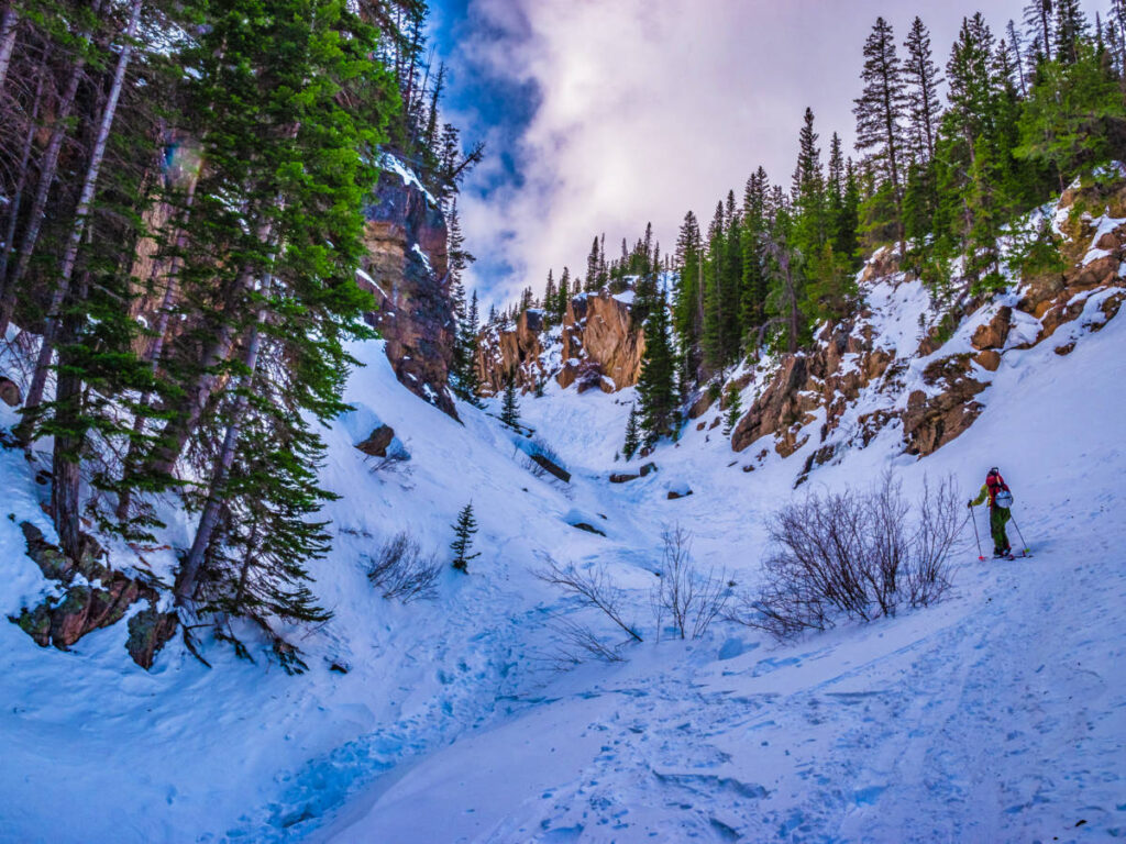 A cross-country skier at the snow covered Rocky Mountain National Park