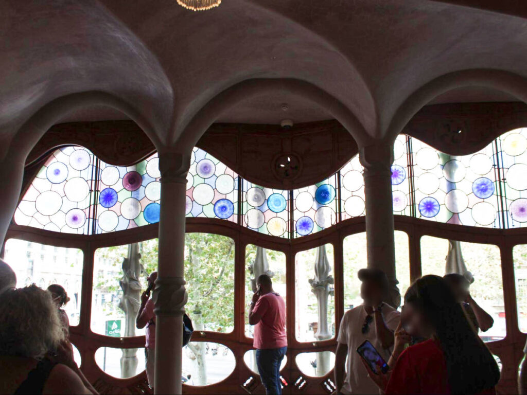 View of the people checking out the famous window at the Batllo House