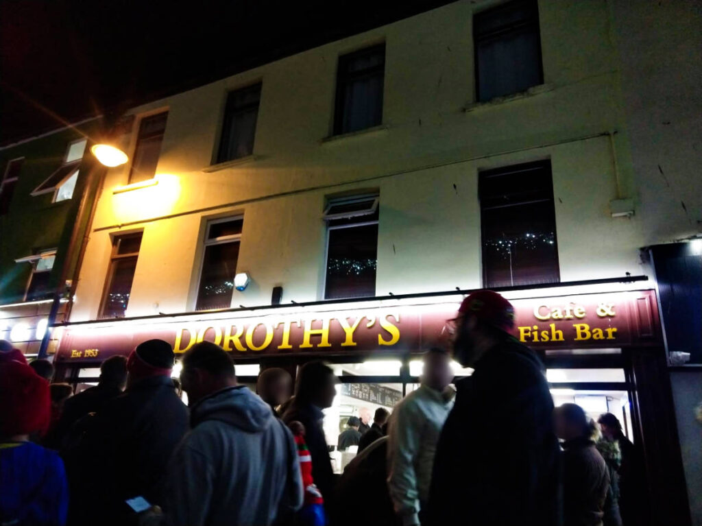 View of the crowd wandering outside Dorothy’s Cafe and Fish Bar