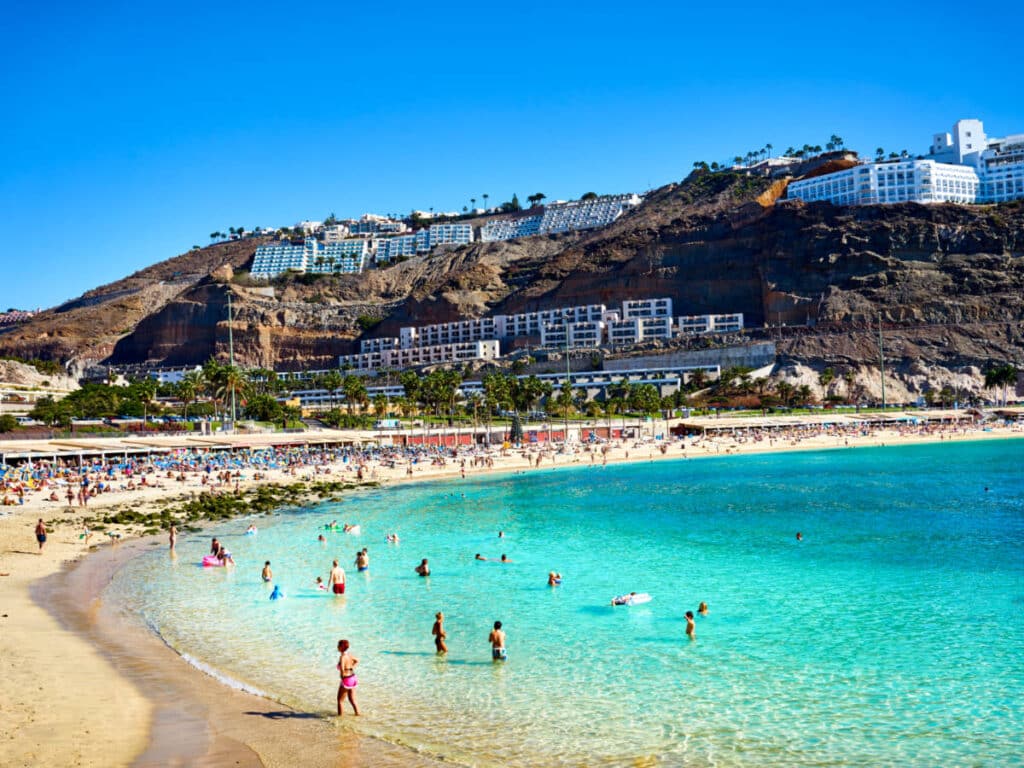View of the crowd chilling at the Amadores Beach on Gran Canaria on a sunny day