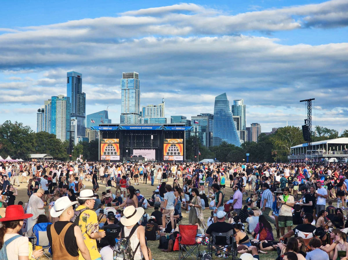View of the crowd at the Austin City Limit Music Festival with the skyline in the background