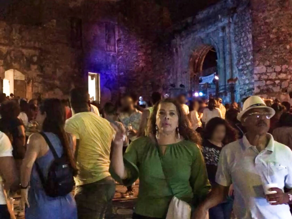 The crowd enjoying with Grupo Bonye at night