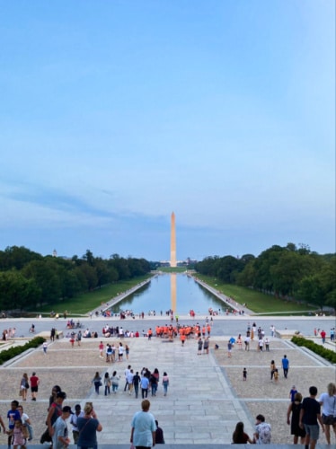 View of the crowd at the Lincoln Memorial with the Washington Monument in the background