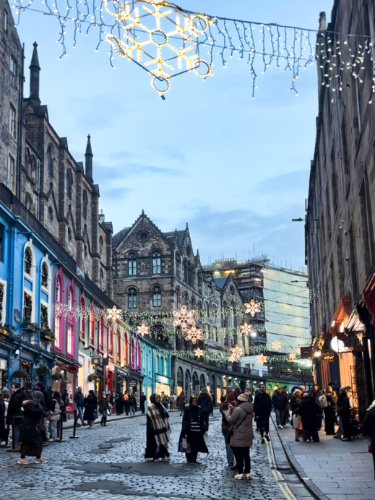 The crowd at the Victoria Street with holiday lights around