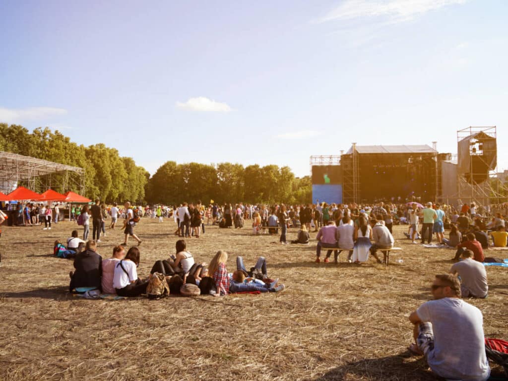 View of the crowd at an outdoor concert on a sunny day