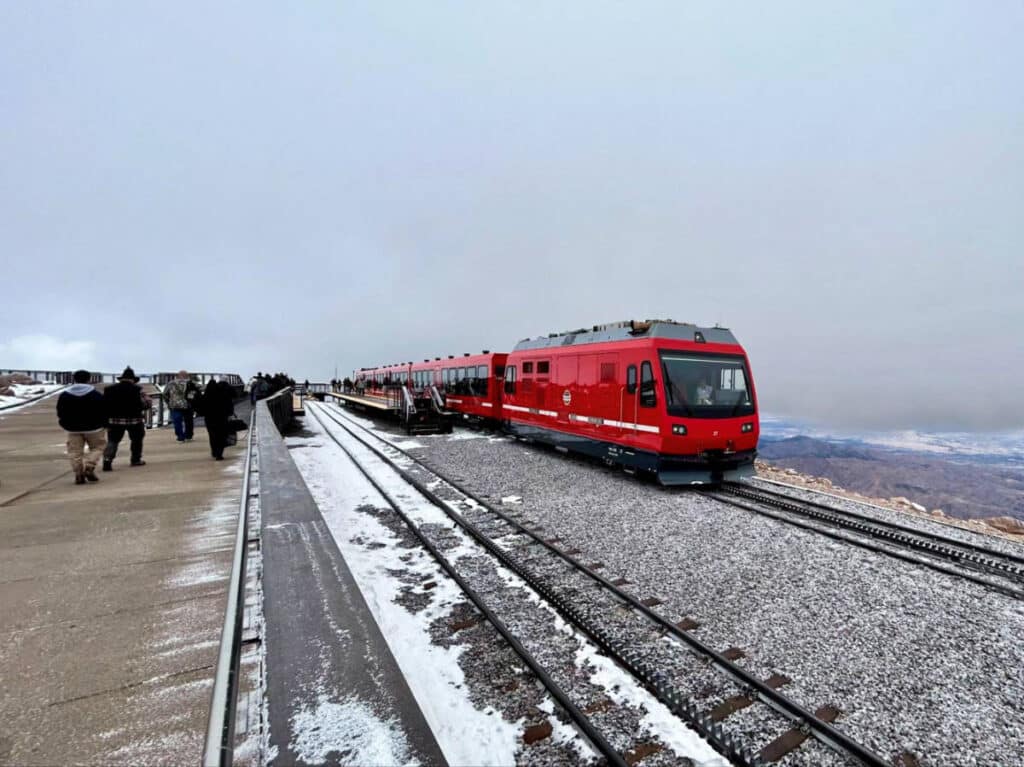 The red train and the crowd at the Pikes Peak Cog Railway