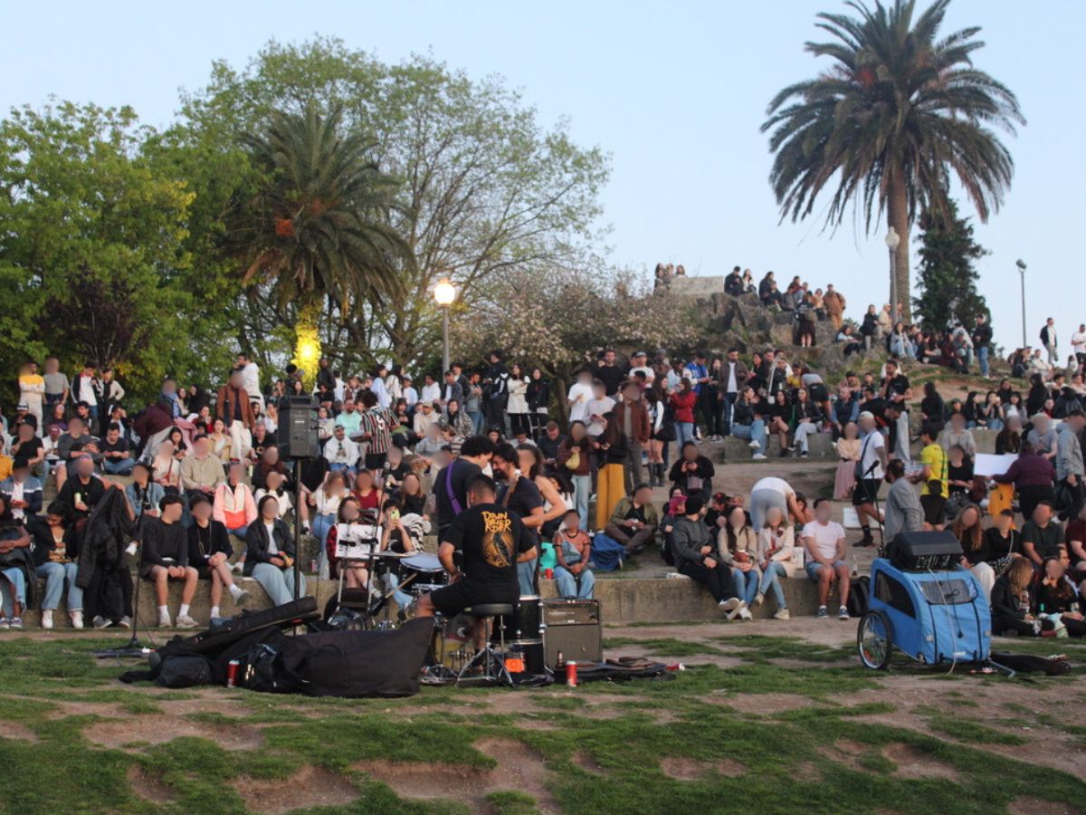 Crowds watching a band perform at a viewpoint in Porto