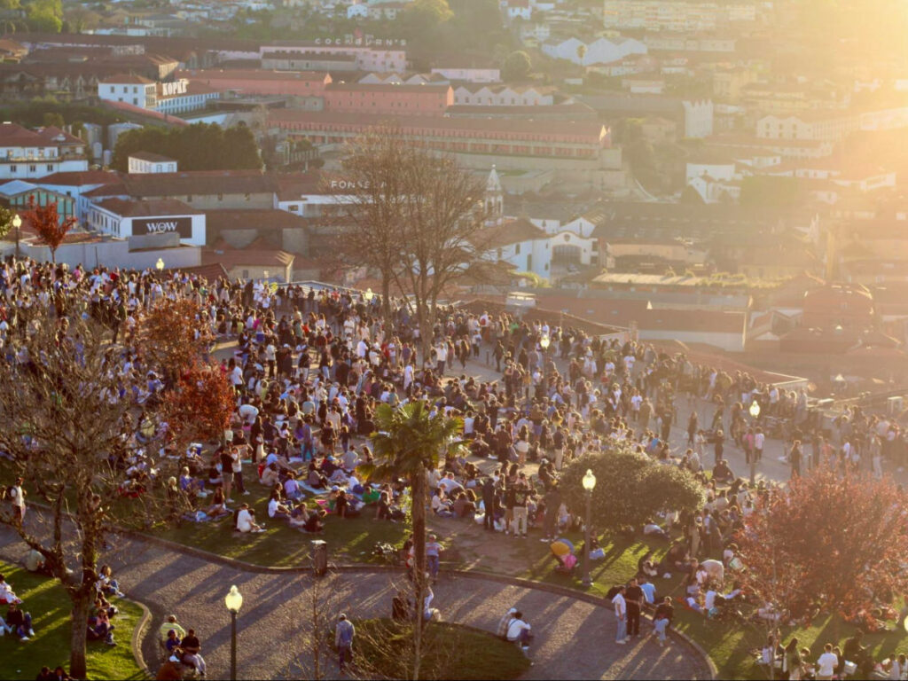 View of a crowd gathering to watch the sunset in Porto