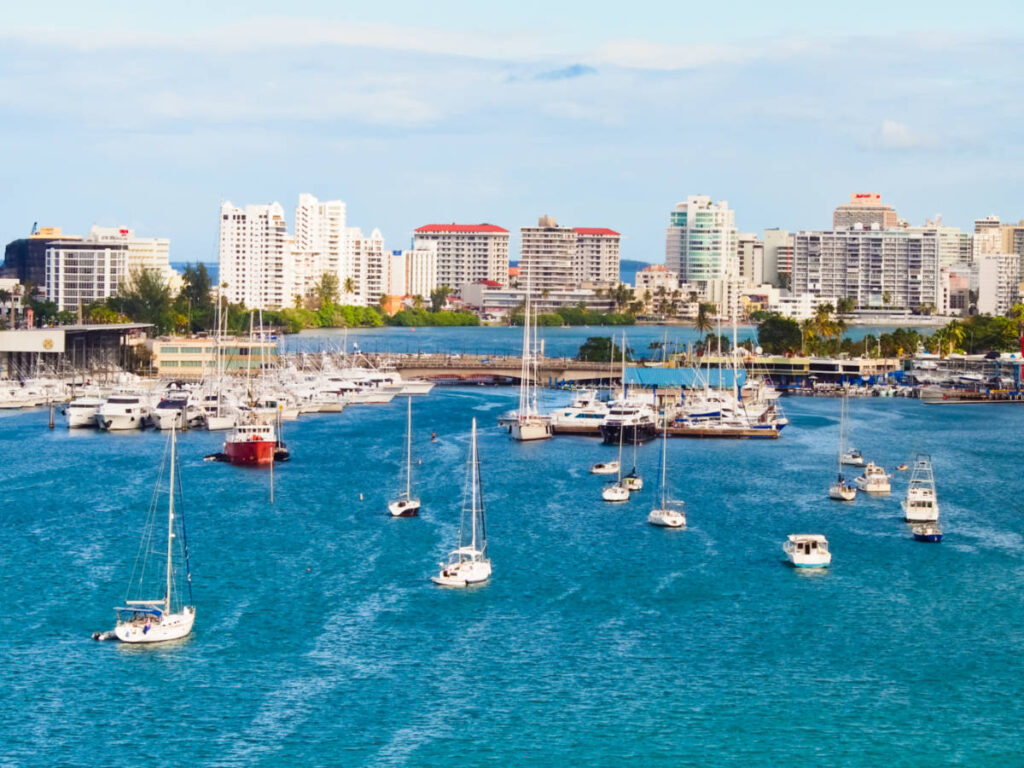 Aerial view of the cruise ships at the pier in San Juan with city skyline views in the background