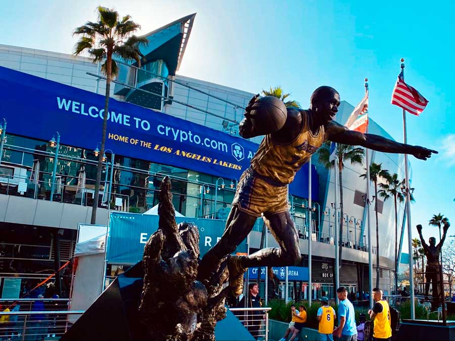 View of people and a statue outside the Crypto.com Arena