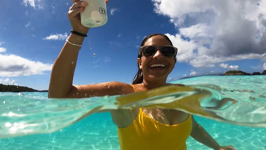 The author's wife enjoying her day at the crystal blue waters of Trunk Bay