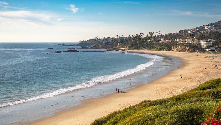 Overlooking view of people enjoying their day in Crystal Cove State Park Beach