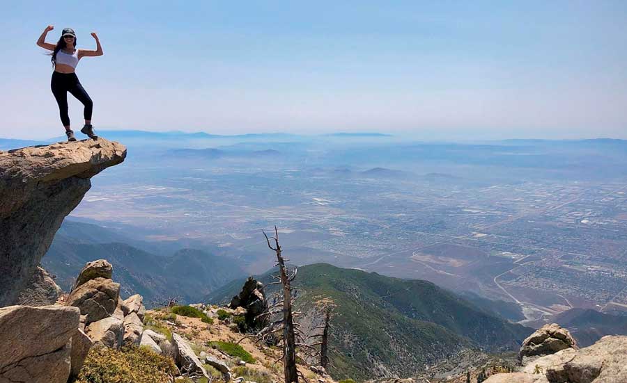 The author posing on top of a cliff in Cucamonga Peak