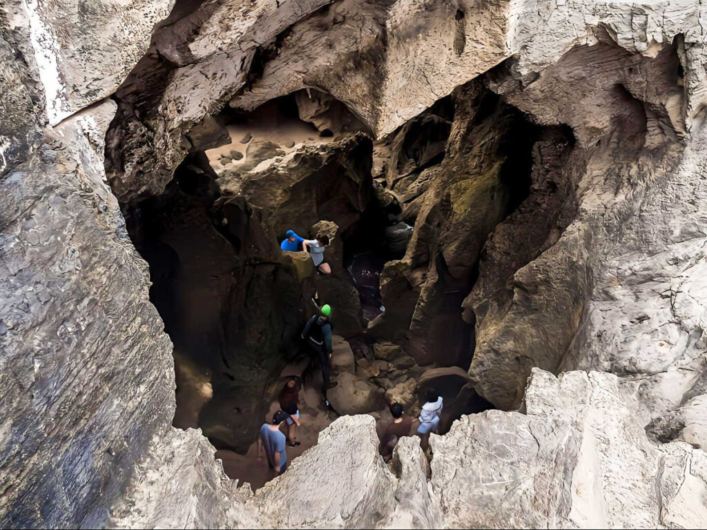 The tourists inside Cueva del Indio seen from the outside