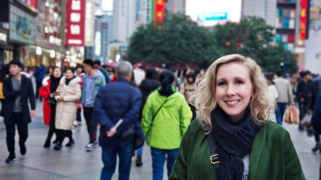 The author Sarah Heath, posing for a photo in the middle of the crowded city of Chengdu, cultural surprises in China
