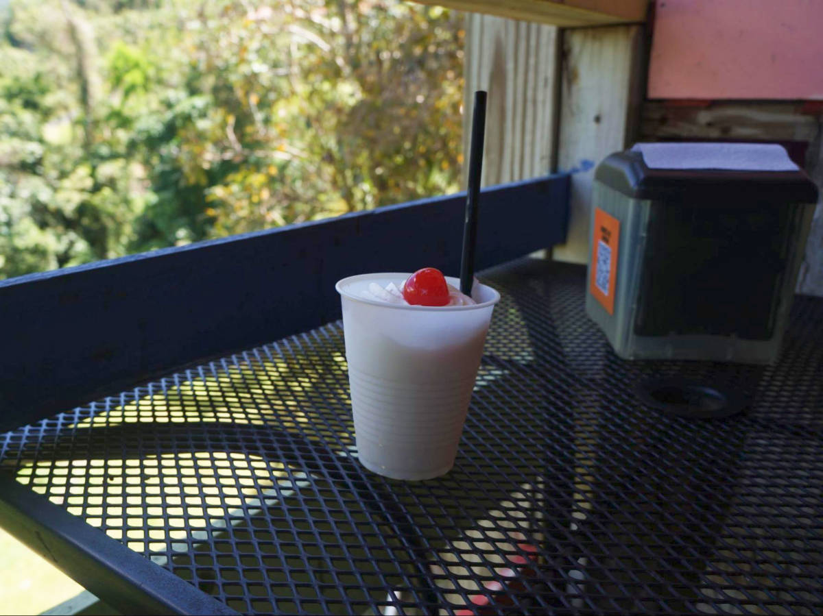 A cup of piña colada on the table