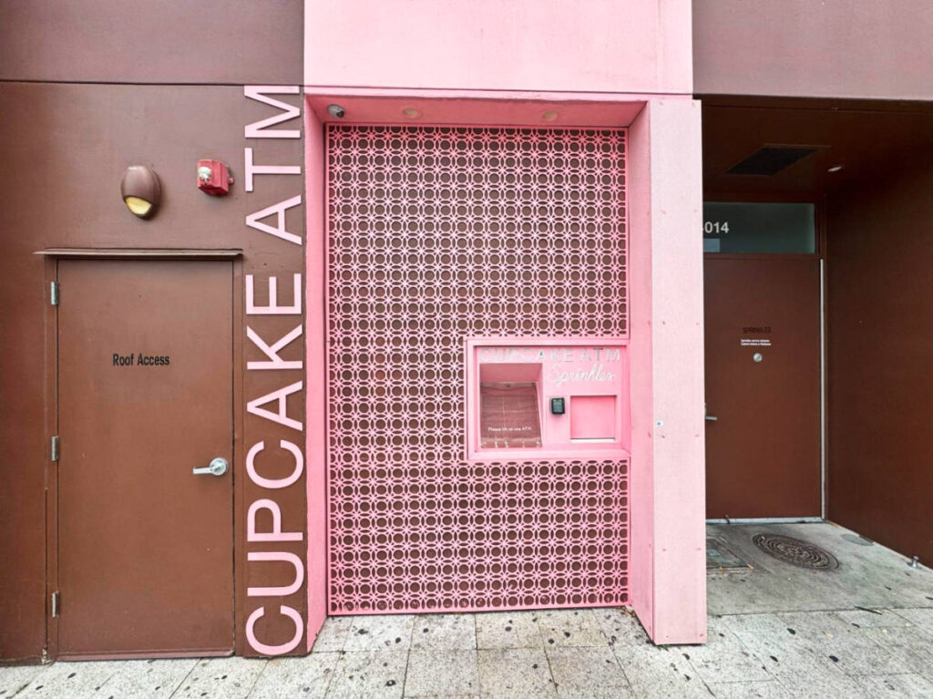 View of the vibrant Cupcake ATM in Highland Village