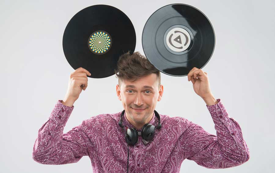 A dj holding disc on his both hands over his head