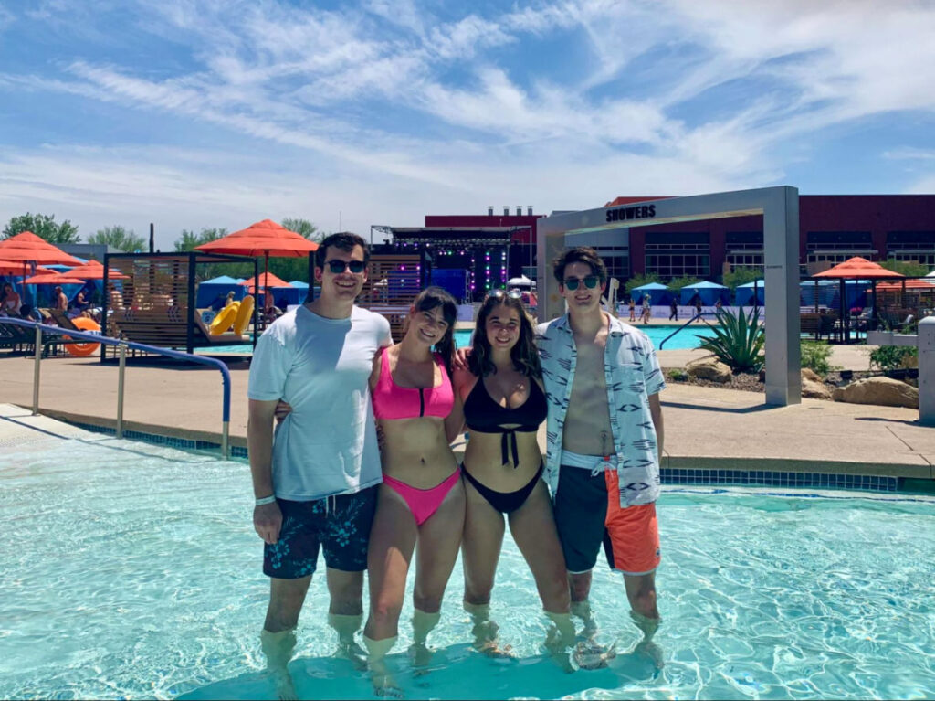 Author Betty Hurd and her friends posing at a DJ pool party at Talking Stick Casino