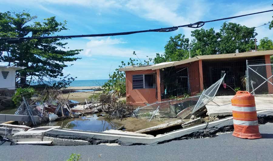 View of a damaged residential home after a hurricane