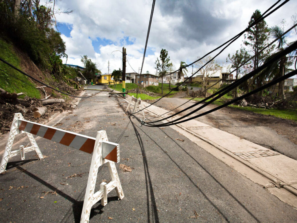 View of the damaged electrical lines along the street after a hurricane