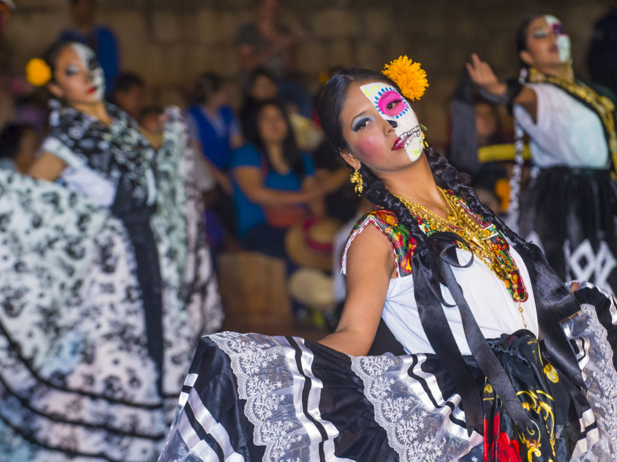 Participants dancing at a Day of the Dead celebration in Oaxaca