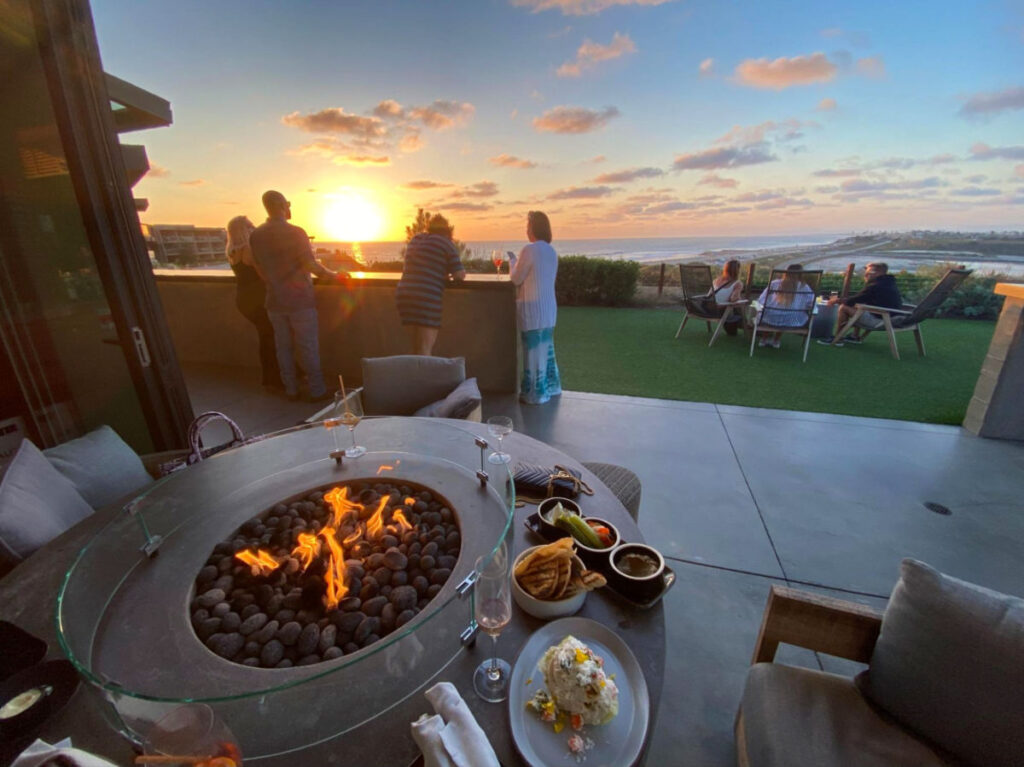 Diners gathered on the patio while enjoying the sunset at VAGA Restaurant & Bar