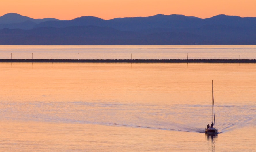 View of a sailboat at dusk in Port Angeles harbor