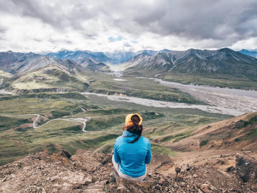 A woman admiring the overlooking view of Denali National Park