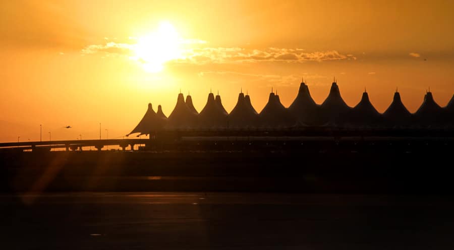 Denver International Airport against the sunset background