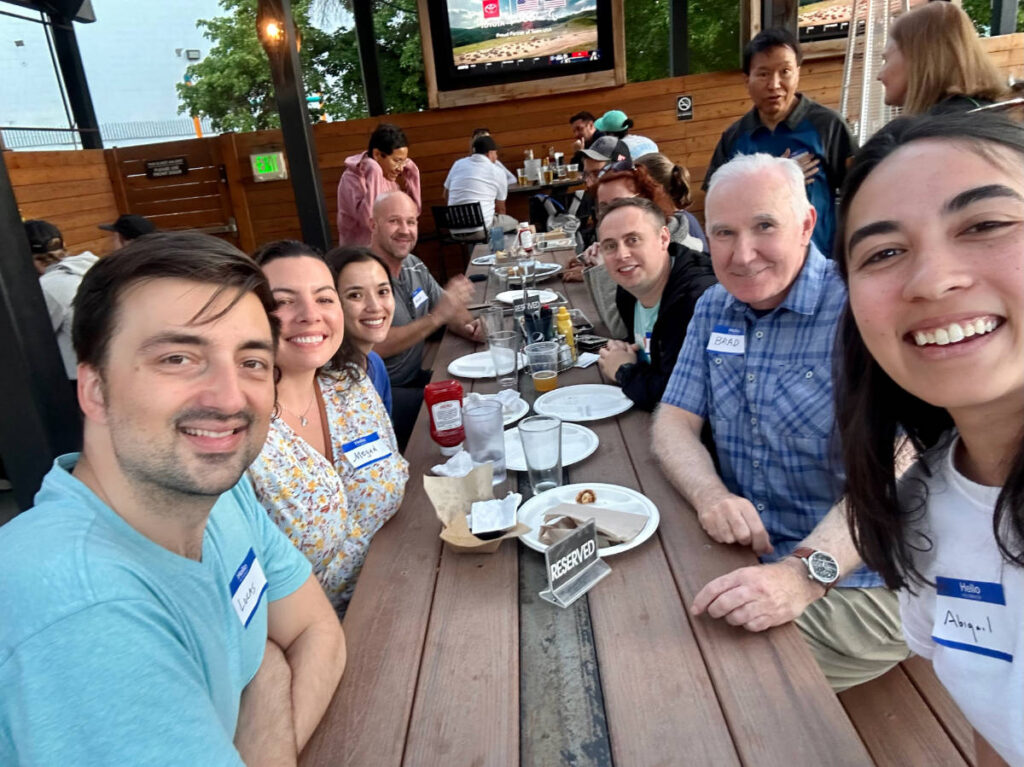 People smiling for a photo during the Travel Lemming's Denver Meetups