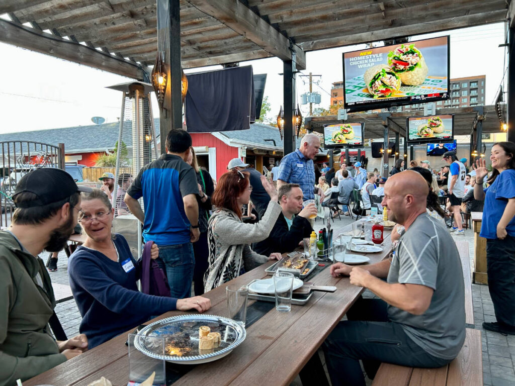 People sharing their travel stories during the Travel Lemming's Denver Meetups