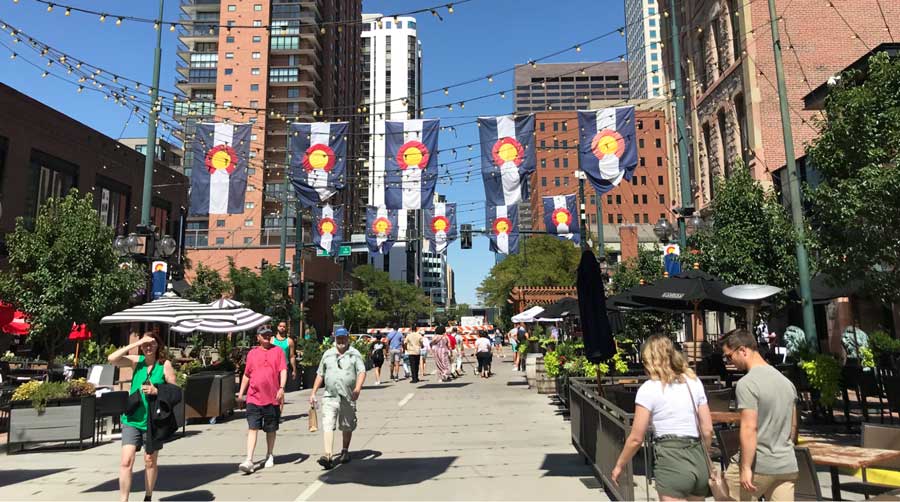 People wandering at the Denver’s LoDo neighborhood