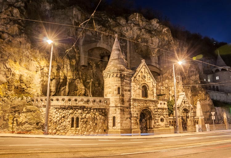 View of the cave church at night, with the street in the foreground