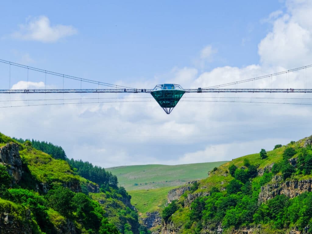 View of the iconic diamond bridge in the middle of the lush mountains in Georgia