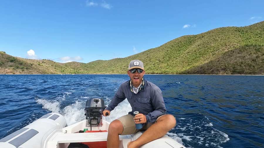 The author driving a boat at the St. John’s north shore