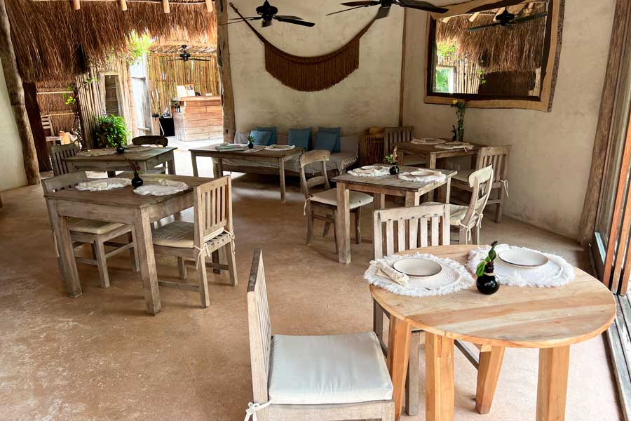 Tables and chairs from a dining area in Encantada Tulum