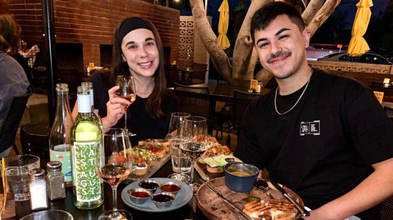 The author's best friends enjoying their food and wine at Postino