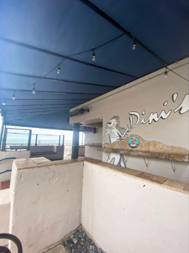 Corner view of the outside of Dini’s Bistro