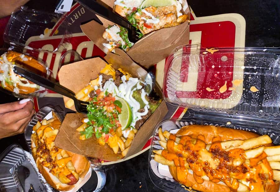 Patty melt hot dogs with carne asada fries and chicharron fries from Dirt Dog