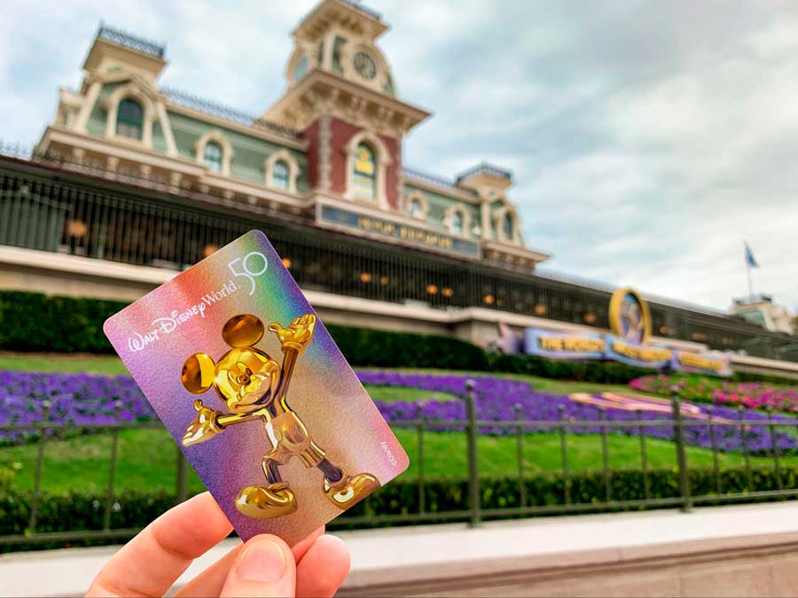 The author holding a Mickey Mouse in a card