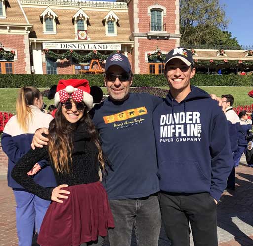 The author with her brother and father at the main entrance of Disneyland