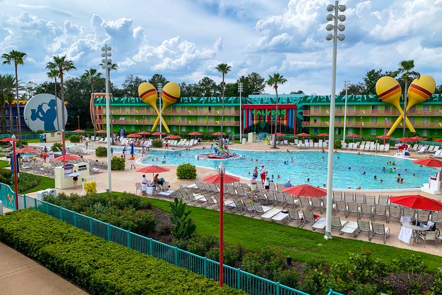 View of people enjoying their day from the pool in Disney’s All-Star Resorts