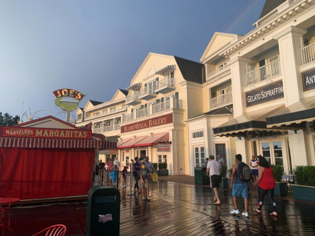 People at the Disney’s Boardwalk after a rain shower