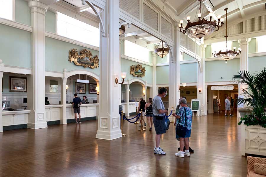 View of people in the check in area of Disney’s Boardwalk Inn & Villas