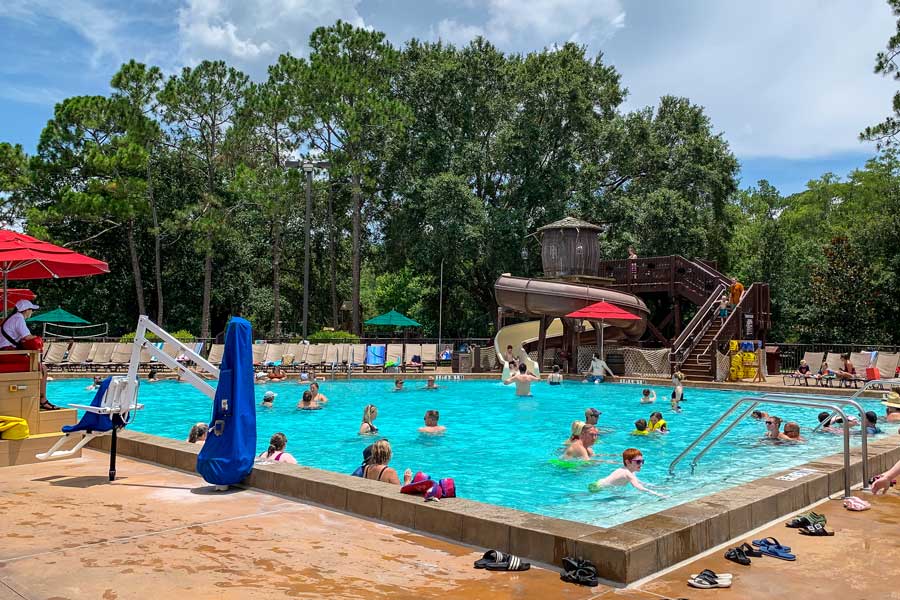 People enjoying their day in a pool in Disney’s Fort Wilderness Resort