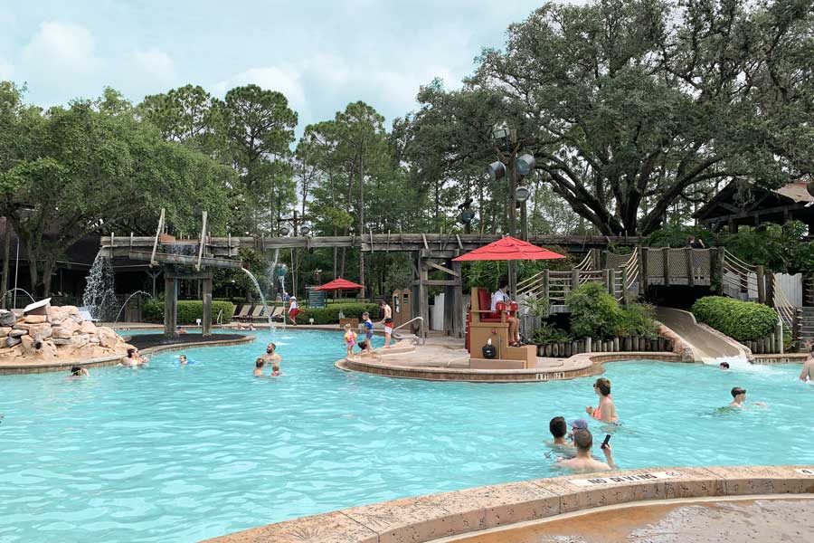 People enjoying their day in a pool in Disney’s Port Orleans Resort - Riverside