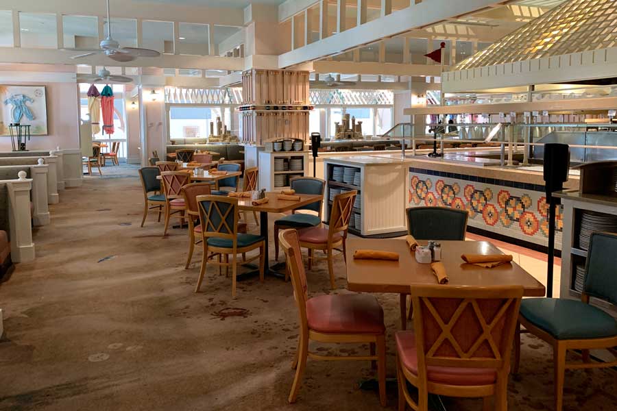 Tables and chairs inside a restaurant in Disney’s Yacht and Beach Club Resorts