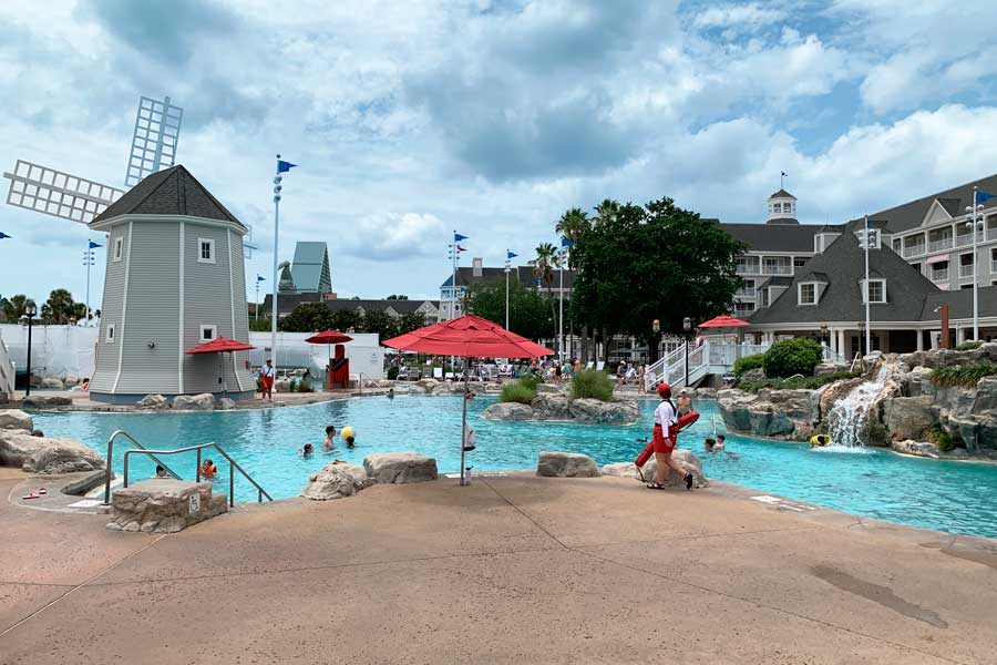 People enjoying their day in a pool in Disney’s Yacht and Beach Club Resorts