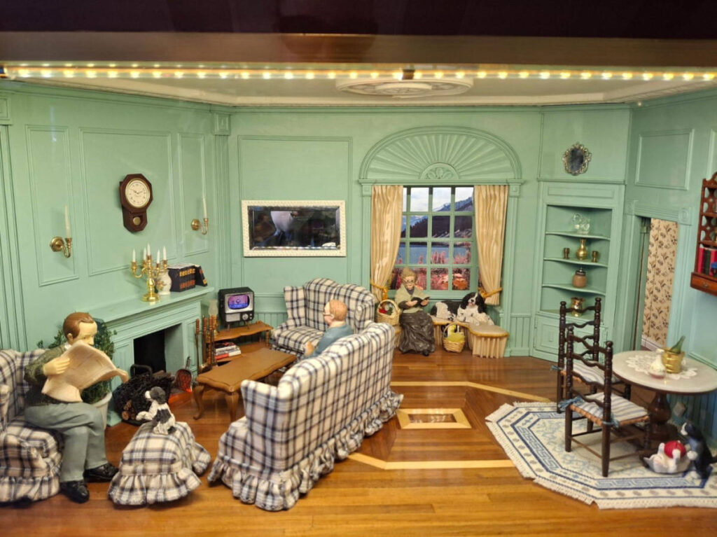 View of a family in the living room miniature displayed in Miniature World